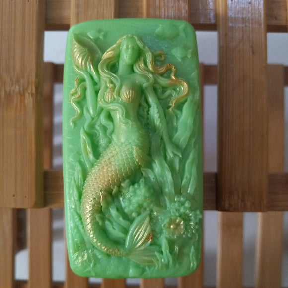 green mermaid and seashells goats milk soap scented with cucumber melon and brushed with gold mica