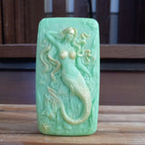 green seaweed serenity mermaid goats milk soap scented with cucumber melon and dusted with gold mica