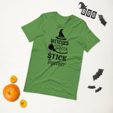 witches gotta stick together black lettering on green tshirt with witch hat and broomstick