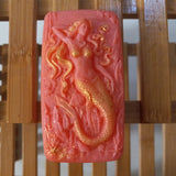 light red hot pink seaweed serenity mermaid goats milk soap scented with red poppy fragrance and bushed with gold mica