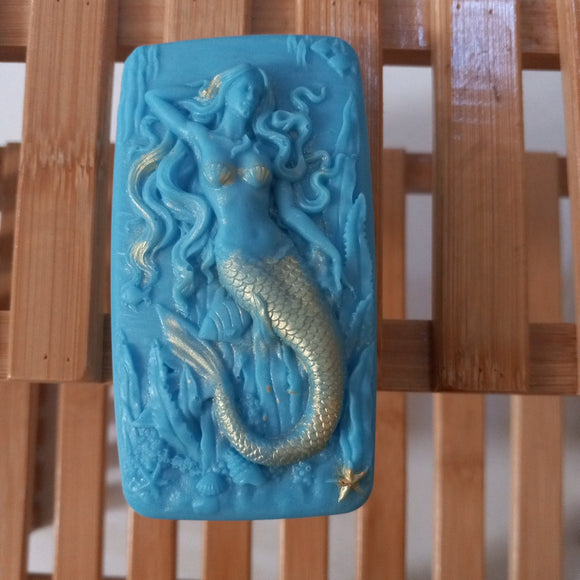 blue mermaid with dusting of gold mica seaweed serenity goats milk soap plumeria scented