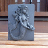black mermaid holding a pearl activated charcoal and tea tree oil goats milk soap
