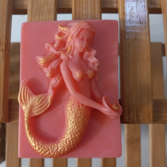 pink mermaid goat milk soap scented with red poppy and decorated with gold mica