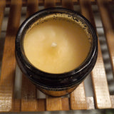 top view of vetiver scented candle in dark gray embossed glass