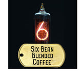 six bean blended coffee, dark roast, pictured with vacume tube and neon glowing number six