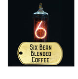 six bean blended coffee, dark roast, pictured with vacume tube and neon glowing number six