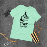 witches gotta stick together black lettering on aqua tshirt with witch hat and broomstick