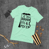if the broom fits fly it black lettering on aqua tshirt for hallowwen with broom witch and flying bat