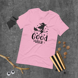 good witch pink tshirt with black lettering and a witch riding a broom