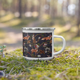 cute woodland creatured enemal coffee mug and tea cup. Pattern of deer, foxes, and wolves with flowering branches on a dark background.