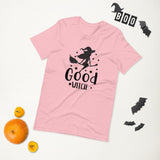 good witch pink tshirt with black lettering and a witch riding a broom