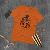 good witch orange tshirt with black lettering and a witch riding a broom