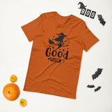 good witch orange tshirt with black lettering and a witch riding a broom