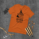 witches gotta stick together black lettering on orange tshirt with witch hat and broomstick